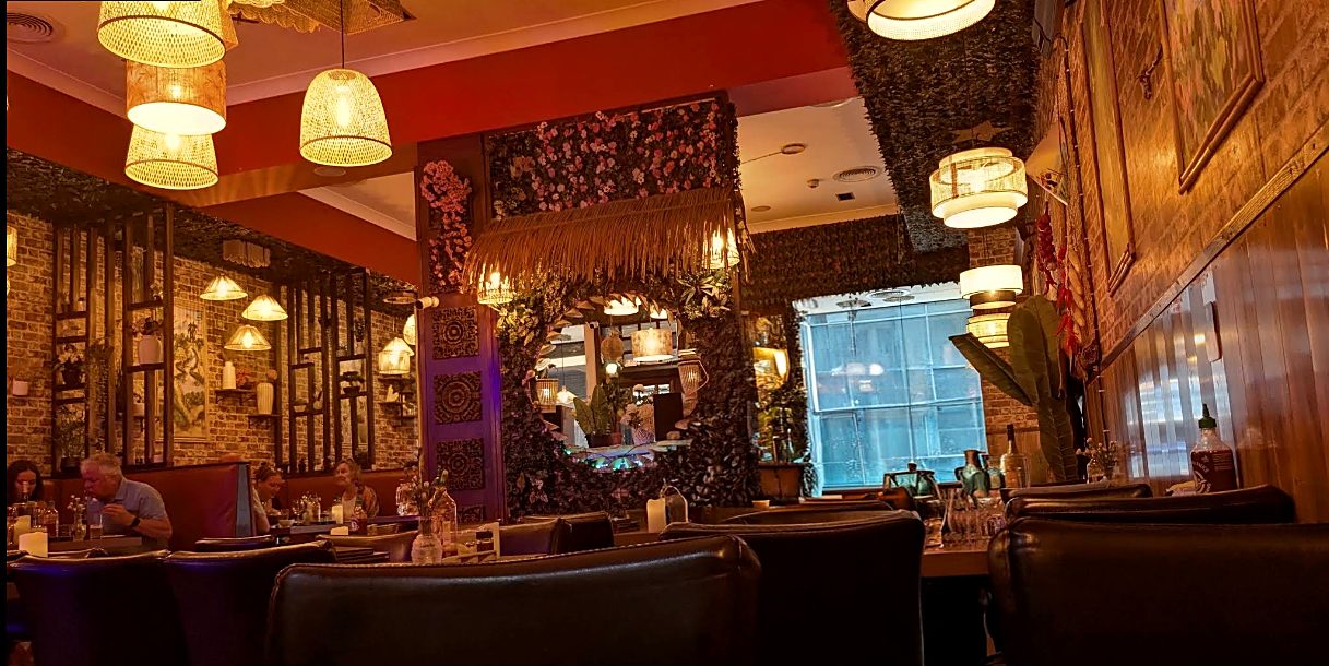 Inside Little Vietnam Glasgow — lanterns, brick walls and warm light